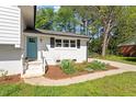 Charming one story home with well landscaped front entrance and blue front door at 3713 Arrowwood Dr, Raleigh, NC 27604