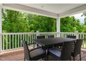 Inviting outdoor dining area with a black wicker table and chairs, perfect for enjoying meals with a view at 42 Saintsbury Dr, Fuquay Varina, NC 27526