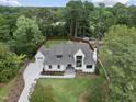 Stunning aerial view of an estate surrounded by lush trees and a private backyard at 5504 Kingwood Dr, Raleigh, NC 27609