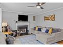 Cozy living room with a fireplace, comfortable seating, and stylish decor at 555 Canterwood Dr, Mebane, NC 27302