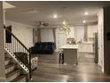 Open living area showcases a kitchen island and a comfortable living space at 6332 Andante Ave, Raleigh, NC 27616