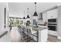 Bright kitchen with a large center island, modern appliances, and ample cabinet space for a chef-inspired cooking experience at 687 Bandon Aly, Cary, NC 27513