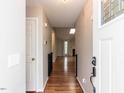 Inviting entryway with hardwood floors and a view into the open-concept living space at 706 Mossburn Ct, Fuquay Varina, NC 27526