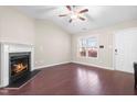 Empty living room featuring fireplace, high ceilings and hardwood floors at 72 E Moss Creek Dr, Clayton, NC 27520