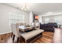 Comfortable dining room featuring a modern table set and elegant chandelier at 1018 Sweet Cream Ct, Durham, NC 27703