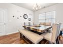 Cozy dining room featuring a modern table set and elegant chandelier at 1018 Sweet Cream Ct, Durham, NC 27703