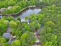 Aerial view of a home in a community with a scenic lake at 102 Windrock Lane, Cary, NC 27518