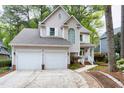 Lovely two-story home with a two-car garage and well-maintained lawn at 102 Windrock Lane, Cary, NC 27518