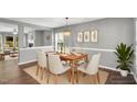 Cozy dining room featuring a wooden table with seating for four guests at 105 Ryder Cup Cir, Raleigh, NC 27603