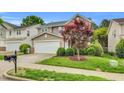 Charming two-story home featuring a two-car garage and manicured front lawn at 105 Ryder Cup Cir, Raleigh, NC 27603