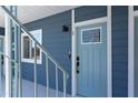 Blue apartment front door with security lock and a decorative window at 1309 Hudson Ave # D9, Durham, NC 27705