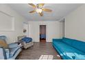 Bright living room featuring hardwood floors, neutral paint, ceiling fan and plenty of natural light at 1329 Mebane St, Burlington, NC 27217