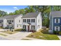Charming two-story home with a well-manicured lawn, a concrete driveway, and classic black shutters at 166 Yellow Jacket Rdg, Clayton, NC 27520