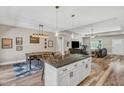 Open-concept living area with a kitchen island, dining area, and modern finishes at 1730 Willie Pace Rd, Burlington, NC 27217