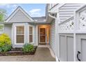 Inviting front entrance with well-manicured landscaping and stone accents at 201 Lakewater Dr, Cary, NC 27511