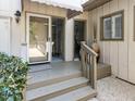Charming entrance with a covered porch, neutral tones, and manicured shrubs at 222 Kelso Ct, Cary, NC 27511