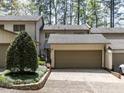 Inviting two-story home featuring a two-car garage and well-maintained landscaping at 222 Kelso Ct, Cary, NC 27511