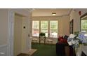 Inviting lobby area with seating, natural light, and elevator access for convenient living at 224 Eyam Hall Ln, Apex, NC 27502