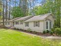 A delightful single-story home featuring classic shutters, a well-kept lawn, and subtle landscaping at 2805 Chelsea Cir, Durham, NC 27707