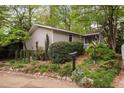 Landscaped home exterior with a mailbox and address number displayed, showing the yard's well-kept bushes and plants at 2852 Rue Sans Famille, Raleigh, NC 27607