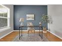Serene home office featuring hardwood floors and a stylish desk arrangement at 3811 Yates Mill Trail, Raleigh, NC 27606