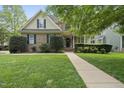 Inviting front of a brick and siding home with manicured lawn and sidewalk to the front door at 429 Gambit Cir, Wake Forest, NC 27587