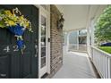 Close-up of a front door with floral decor and house number at 429 Gambit Cir, Wake Forest, NC 27587