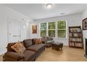 Cozy living area filled with natural light, featuring a comfortable sofa at 433 Wait Ave # 100, Wake Forest, NC 27587