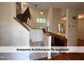 Beautiful staircase with carpeted steps and a wooden banister, leading to the upper level of the home at 4420 Beechnut Ln, Durham, NC 27707