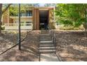 Brick building featuring covered stairwell leading to upper units at 4507 Edwards Mill Rd # F, Raleigh, NC 27612