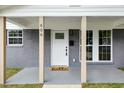 Inviting front entrance with white door, decorative glass, and neutral-toned welcome mat at 606 Cecil Street St, Durham, NC 27707