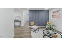 Stylish living area with modern decor, accent wall, and neutral color palette at 606 Cecil Street St, Durham, NC 27707