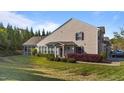 Lovely home exterior featuring mature landscaping and a screened porch at 617 Sealine Dr, Cary, NC 27519