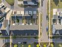 Aerial view of a townhouse community showcasing the layout and nearby streets at 6511 Academic Ave, Raleigh, NC 27616