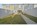 Fenced backyard with a patio area, pergola, and well-maintained lawn, ideal for outdoor living at 6511 Academic Ave, Raleigh, NC 27616