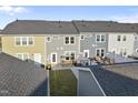 Townhouse backyards featuring patios for outdoor living and entertaining at 6511 Academic Ave, Raleigh, NC 27616