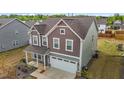 Picturesque home featuring pristine landscaping, and a 2-car garage in a desirable neighborhood at 7205 Tillage Rd, Mebane, NC 27302