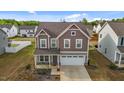 Well-manicured home boasting a lush lawn and inviting curb appeal at 7205 Tillage Rd, Mebane, NC 27302