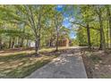 Secluded home on a sprawling lot with mature trees and a private driveway at 8022 Hogan Dr, Wake Forest, NC 27587
