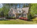 Beautiful brick home with lush landscaping, inviting curb appeal, and classic architectural details at 903 Oldwyck Dr, Fuquay Varina, NC 27526