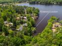 Aerial shot of waterfront property with lake views near 959 Sagamore Dr Louisburg at 959 Sagamore Dr, Louisburg, NC 27549