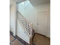 Bright staircase with white railing and trim leading to the upper level at 10 Relaxing Way, Pittsboro, NC 27312