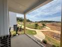 Scenic view from the porch overlooking the landscaped community area at 10 Relaxing Way, Pittsboro, NC 27312