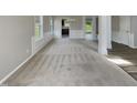 Spacious open-plan living area featuring a neutral palette and ample natural light at 10 Sandy Bluff Ct, Durham, NC 27703