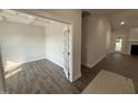 Bright, airy living space with hardwood floors, a ceiling with beams, and a door to the backyard at 1000 Peedin Rd, Selma, NC 27576