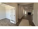 Spacious living room featuring hardwood floors, fireplace, and an open floor plan at 1000 Peedin Rd, Selma, NC 27576
