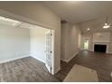 Bright living room boasts a fireplace, hardwood floors, recessed lighting, and an open layout at 1000 Peedin Rd, Selma, NC 27576