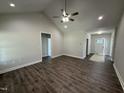 Spacious living room with vaulted ceiling, hardwood floors, and recessed lighting throughout at 1000 Peedin Rd, Selma, NC 27576