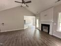 Bright living room with open access to the kitchen and a statement fireplace at 1000 Peedin Rd, Selma, NC 27576