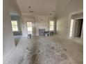 Spacious living room with a cozy fireplace, bathed in natural light from the surrounding windows at 1000 Peedin Rd, Selma, NC 27576